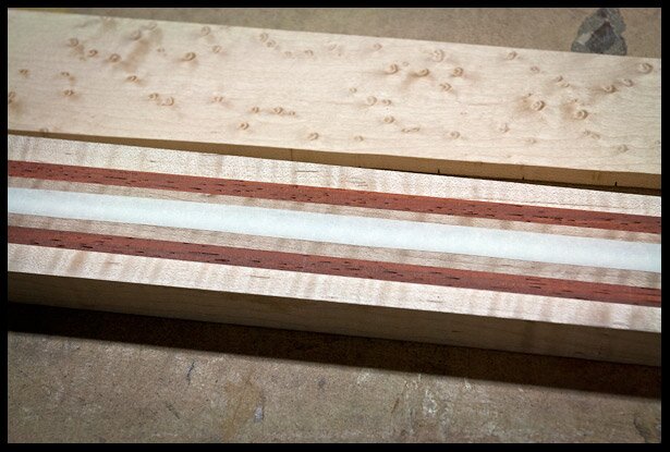 Place masking tape over the truss rod channel