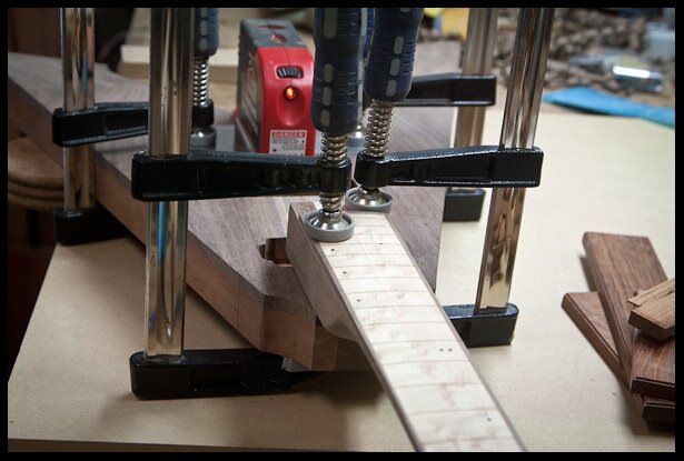 Aligning the neck to the body using a laser