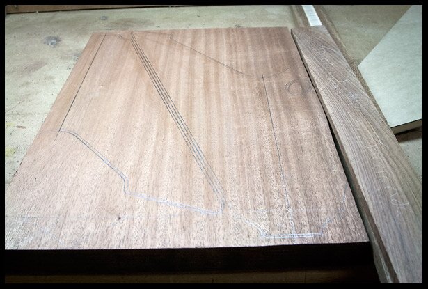 Tracing the body shape on the mahogany board