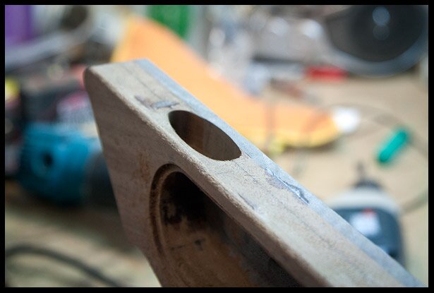 Recessed output jack cavity carved