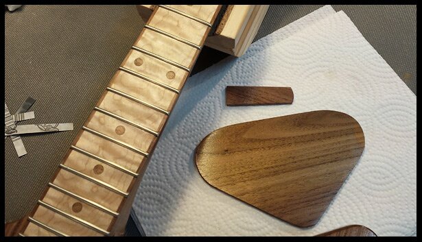 The neck, electronics cavity cover and truss rod cover