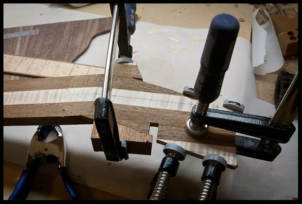 After the scarf joint is glued, I add extra pieces to the headstock