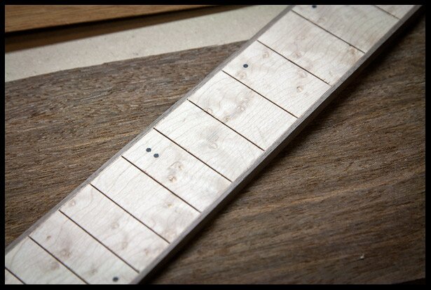 Birdseye fretboard with binding and dot inlays