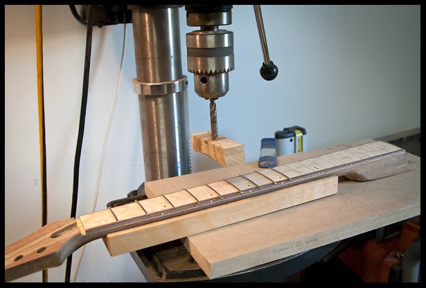 Pressing the frets