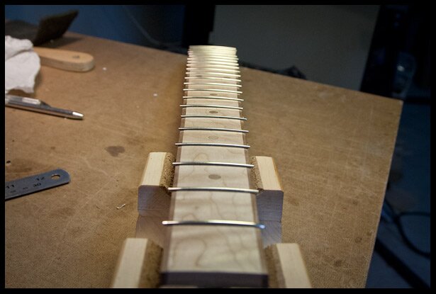 The fretboard with frets installed