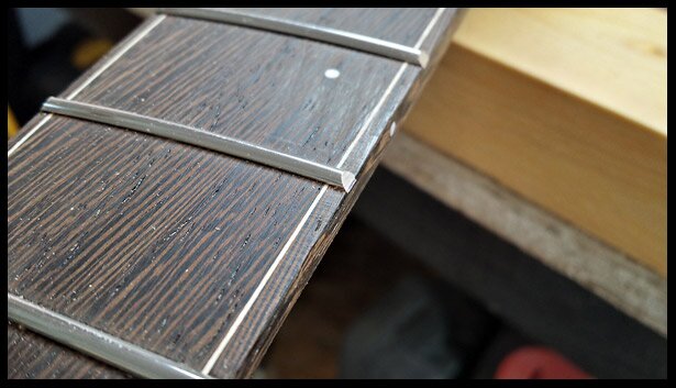 fret ends beveled to 35 degrees