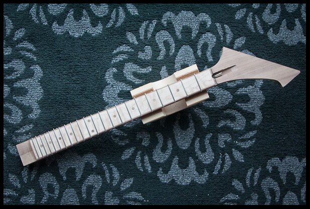 The fretboard with frets installed