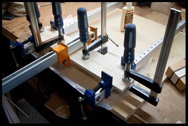 Gluing and clamping maple to make the headstock veneer