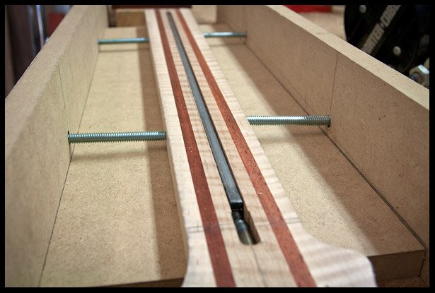 Truss rod in channel