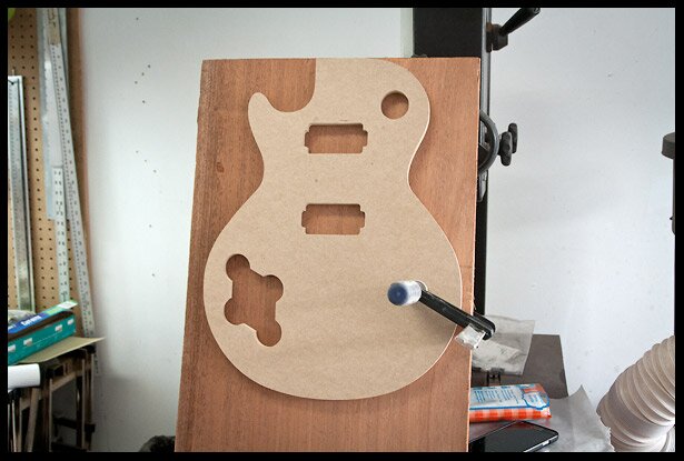 Sizing the mahogany with the template