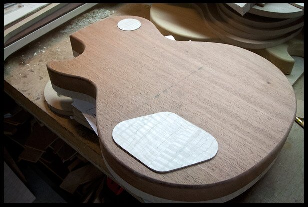 Test-fitting the covers, they are still high and will eventually be sanded flush with the body