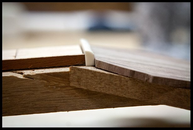 Putting an angle on the edge of the headstock veneer