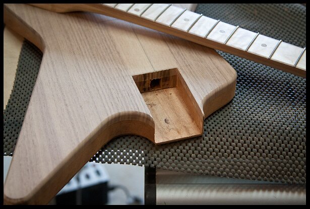 Neck pocket hole carved