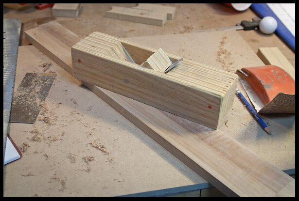 planing the neck surface flat. This is where the fingerboard will sit.