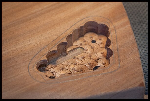 Removing the bulk of the wood with a Forstner bit