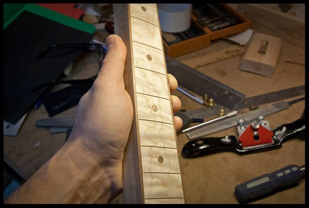 sanded the fretboard to 320 grit followed by steel wool