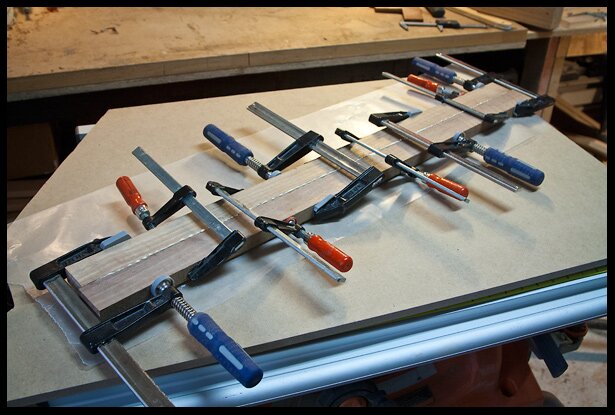 gluing the pieces of walnut for the neck