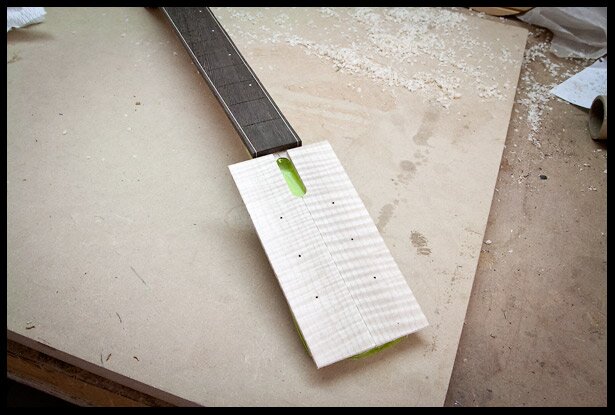 The maple veneer is glued on