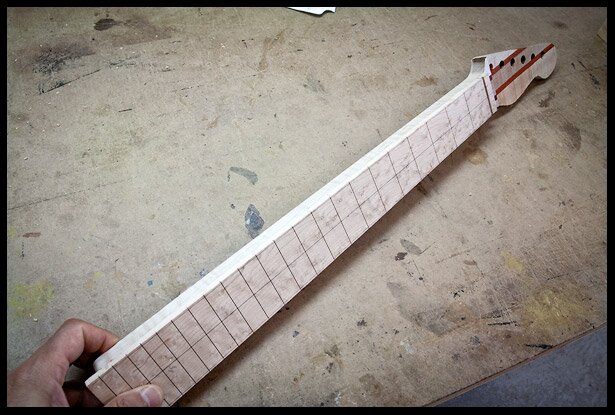 The fretboard is glued on 